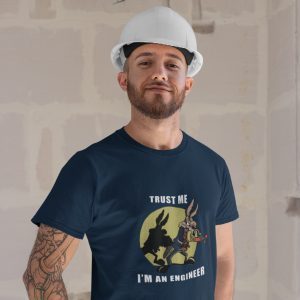 Trust Me I’m an Engineer graphic t shirt featuring Wile E. Coyote cartoon design, model wearing black tee