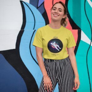 Women's graphic t-shirt with cosmic planet print – yellow cotton tee for casual streetwear fashion.