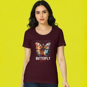 Woman wearing a maroon Butterfly Effect graphic t-shirt with a colorful butterfly print — Salt & Soil