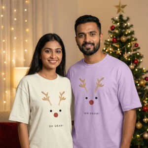 Couple wearing Oh Dear Christmas T-shirts with reindeer print, showcasing matching festive men's, women's and family Christmas T-shirts