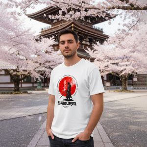 Male model wearing the Samurai Spirit T-Shirt by Salt & Soil, featuring a Japanese samurai warrior graphic and red sun background near a traditional temple with cherry blossoms.