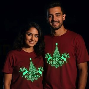 couple wearing matching glow in the dark Christmas T-shirts in a dim room, Night Glow limited edition tee by Salt & Soil
