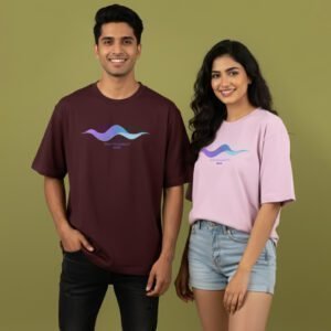 Two models wearing Salt & Soil “New Frequency 2026” oversized premium t-shirts in maroon and pink colors.