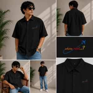 Man wearing black Salt and Soil oversized holiday shirt with blue airplane embroidery.